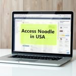 User accessing Noodle Magazine website on a laptop using a VPN connection in the United States.